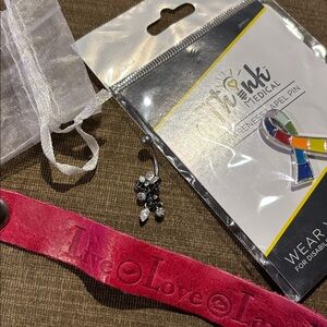Think! Pink Leather Bracelet and Navel Ring and lastly, a Cancer Awareness Pin!